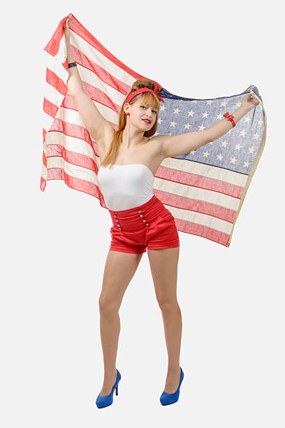 istock young woman with an American flag 544349880