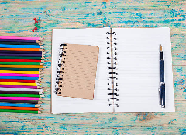 istock white notebook ,pen and office supplies 544350474