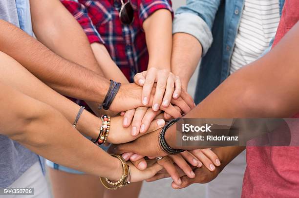 Stacked Hands Of Friends Stock Photo - Download Image Now - Stack, 20-29 Years, Adolescence
