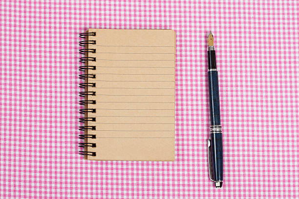 istock Recycled paper notebook  on Clothing Fabric Texture 544351308