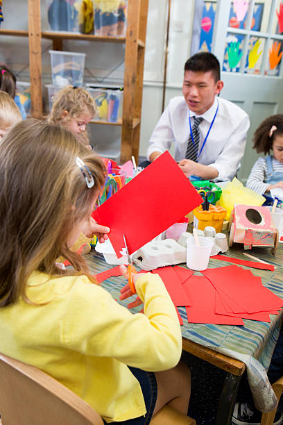 istock Little Girl Cutting Paper 544351582