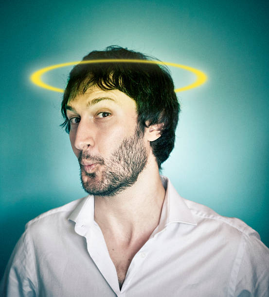 istock Angelic man with a halo on the head 544352036