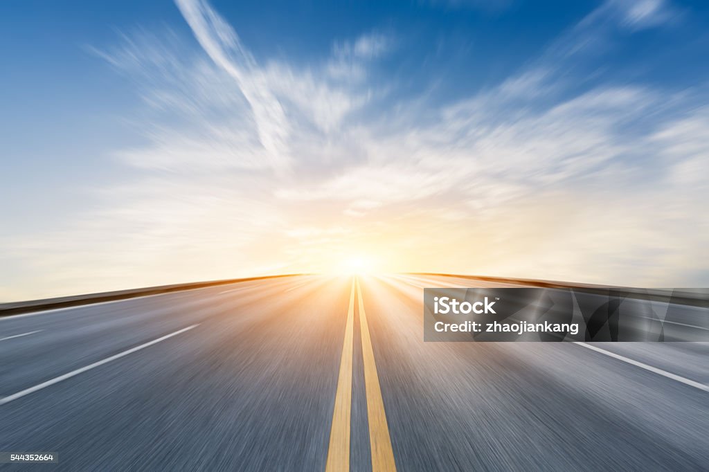 Fuzzy motion asphalt highway scenery at sunset Fuzzy motion asphalt highway Beautiful scenery at sunset Road Stock Photo