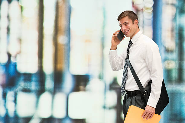 istock Smiling businessman on phone in office 544353572