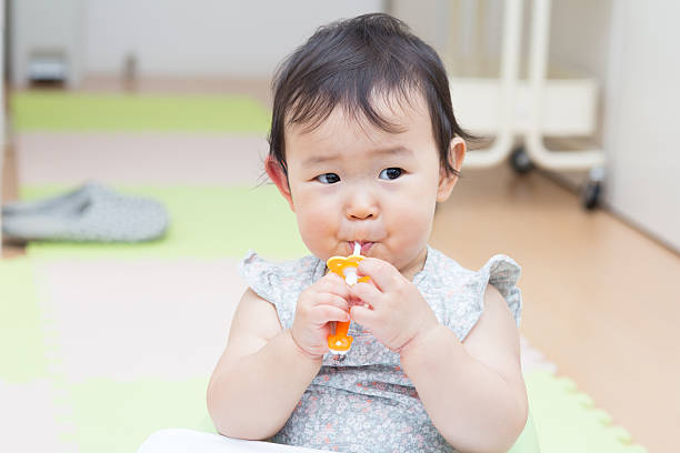 istock Cute baby brush teeth 544353596