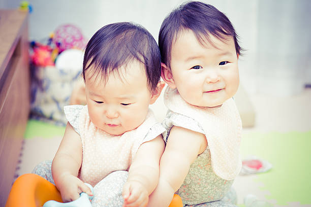 4,700+ Asian Twins Stock Photos, Pictures & Royalty-Free Images - iStock | Fraternal twins, Cute twins, Asian woman shopping