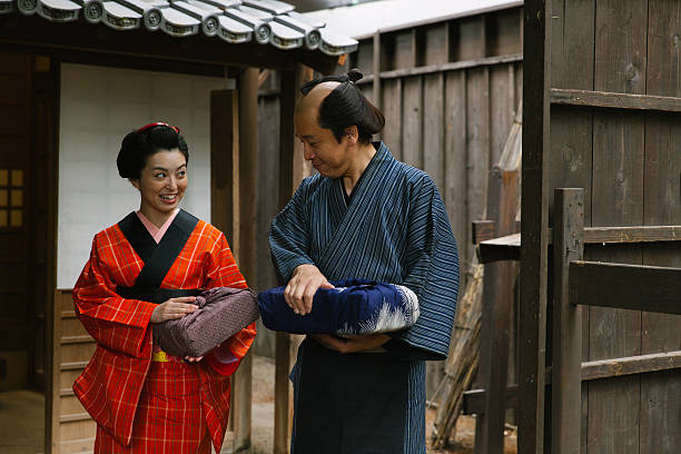 istock The Japanese couple talking at gareage  in Edo perioud. 544354224
