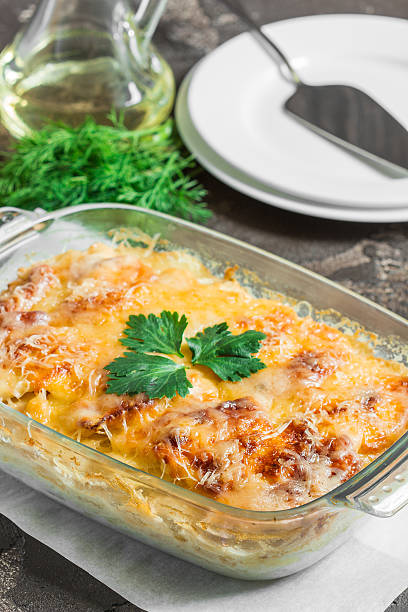 istock Casserole with with melted cheese, fresh green apple and lemon 544355050