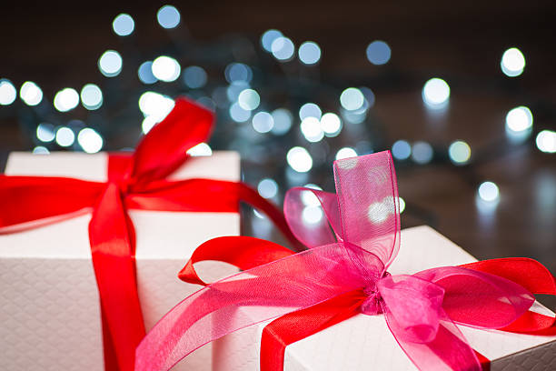 istock Christmas gift boxes with red bow and lights 544355150
