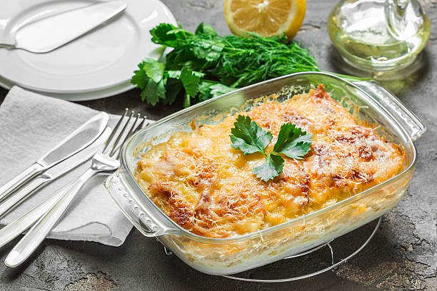 istock Potato casserole with melted cheese, fresh green apple and lemon 544355222