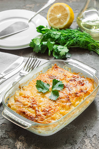 istock Potato casserole with melted cheese, green apple and lemon 544355440