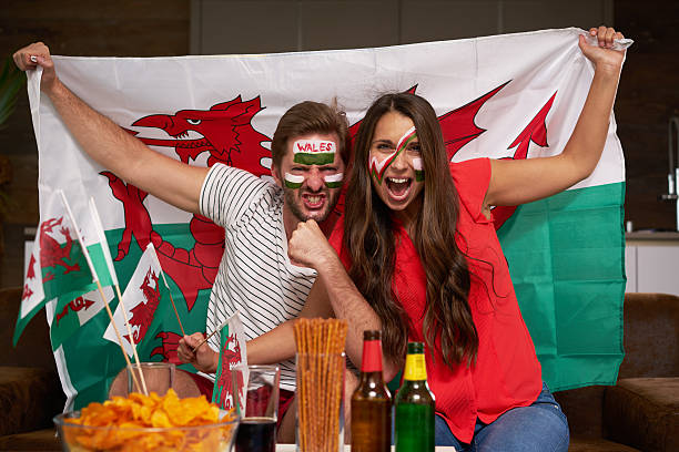 enthusiastic Welsh fan couple
