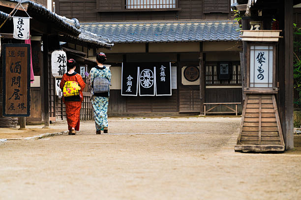 istock Geishas walking along a street 544356262
