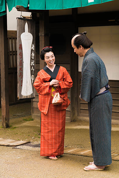 istock Japanese man talking to a geisha 544356920