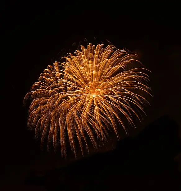 Photo of Fireworks. American day.Independence day, July 4. Orange explosion