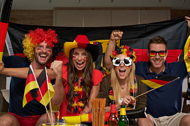 istock thrilled german soccer fans 544358448