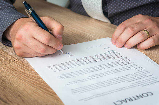 istock Businessman signing a contract to conclude a deal 544358466