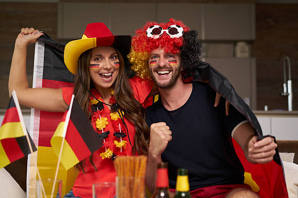 istock funny German soccer fan couple 544358580