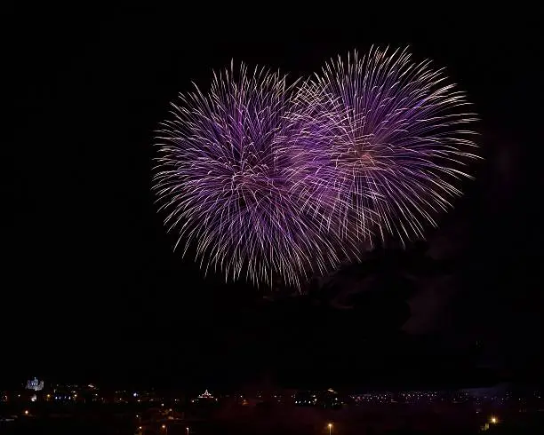 Photo of Blue and violet colorful fireworks. Malta fireworks festival. 4 July.