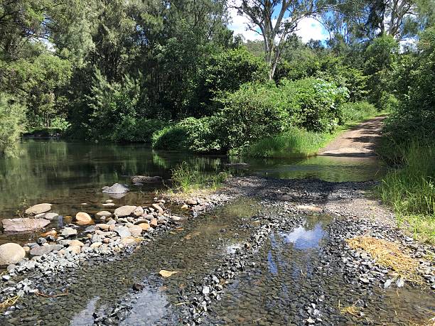 istock Road Crossing a Creek. 544443276