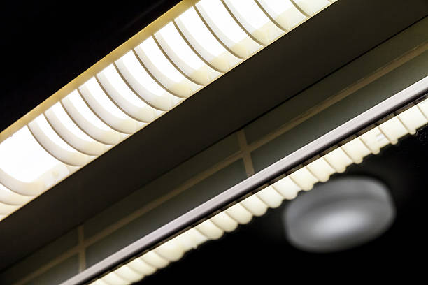 istock Neon lamps glowing over dark ceiling 544443558