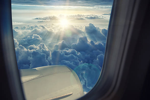 istock Wing of the plane on blue sky 544443566
