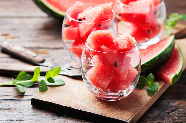 istock Sweet red watermelon and mint on the wooden table 544445942