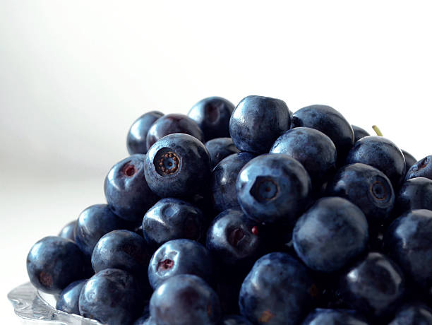 istock Ripe blueberries in a small glass plate 544447390