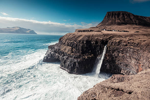 istock Faroe Islands with cliff and waterfall 4 544448480