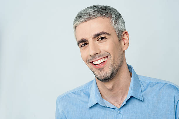 istock Smiling young man posing to the camera 544448648