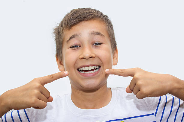 istock Portrait of laughing boy showing his clean, white teeth 544449486