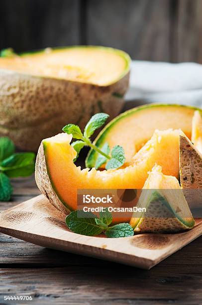 Fresh Sweet Orange Melon And Mint Stock Photo - Download Image Now - Cantaloupe, Melon, Agriculture