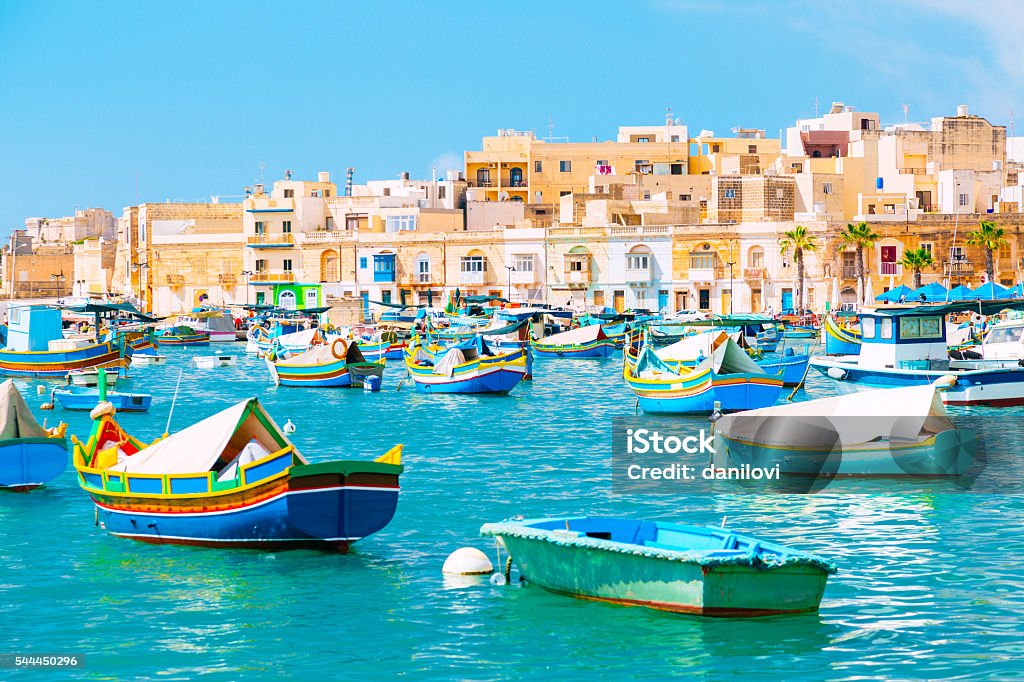 Marsaxlokk Harbor, Malta Marsaxlokk Harbor. Marsaxlokk in Malta is a fishing village in the Southpart famous for its fish market, colourful boats and fish restaurants. Marsaxlokk Stock Photo