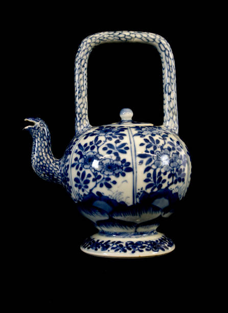 istock Blue and White Antique Chinese Teapot on Black Background 544452114