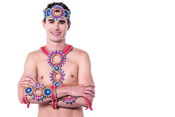 Handsome samba dancer posing with folded arms.