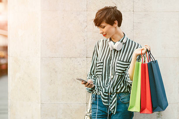 istock Beautiful Young Woman Using Smart Phone In The City 544452990