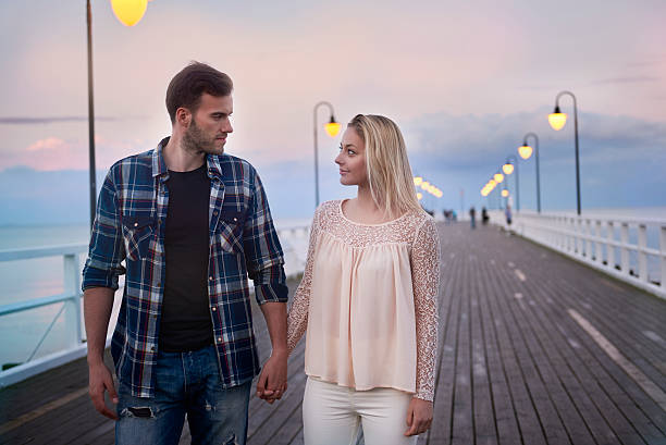 istock Loving couple during the romantic walk on the pier 544454808