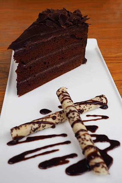 istock Chocolate cake on a white plate decorate wafer roll topped chocolate 544455126