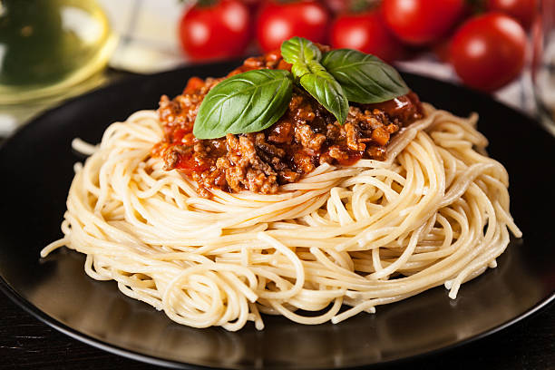 istock Spaghetti bolognese on dark background 544457296