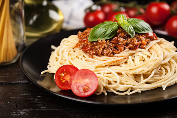 istock Spaghetti bolognese on dark background 544457388