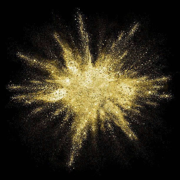 Gold glitter powder explosion. Golden color dust splash. Gold powder particles explosion. Glitter burst with golden texture. Golden color dust splash for fashion background, luxury wallpaper. Magic mist glowing. Powdered vivid gold on black background. exploding stock pictures, royalty-free photos & images