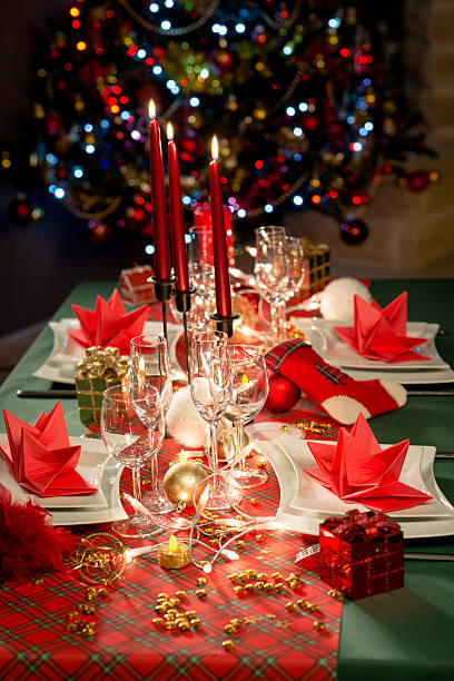 istock red and golden christmas table decoration with dim light candle 544460496
