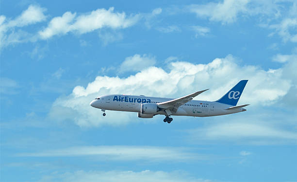 airplane of Air Europa flying in clouds - Boeing 787 stock photo