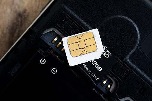 sim card and micro sd card on smart phone, soft focused