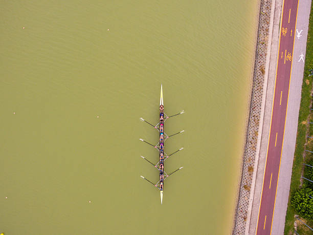 Plovdiv, Bulgaria - June 5, 2016: Aerial view of eight women team boat training on the rowing channel in Plovdiv, Bulgaria.