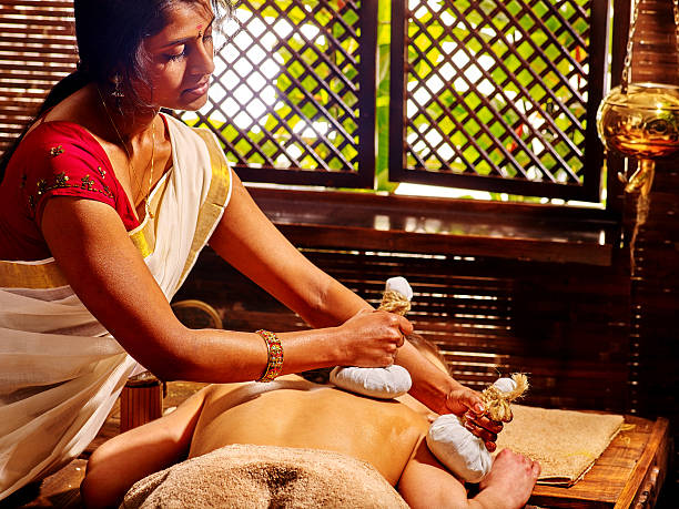 istock Woman having massage with pouch of rice. 544462844