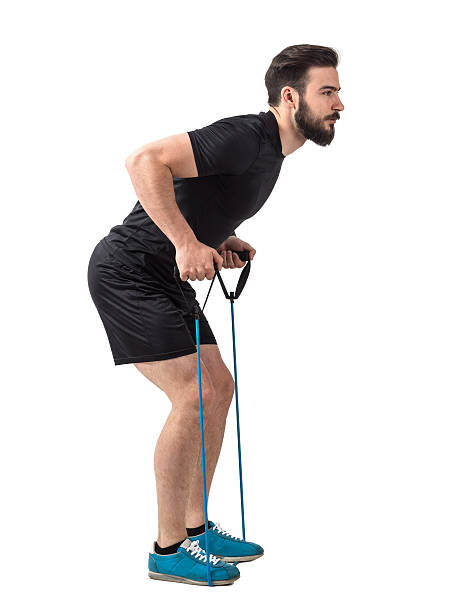istock Side view of young athlete with resistance bands back exercise 544464056