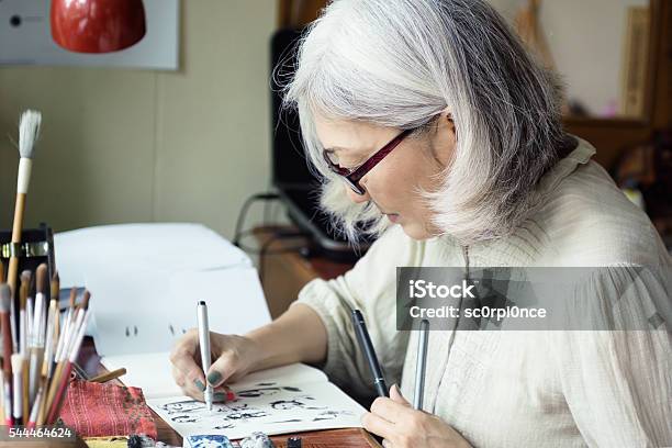 Asian Senior Woman Artist Sketching Stock Photo - Download Image Now - Drawing - Activity, Drawing - Art Product, Senior Adult