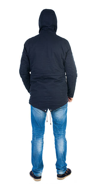 istock Back view of handsome man in winter jacket  looking up. 544466212