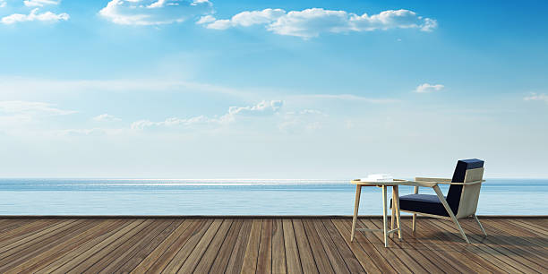 istock Simple armchair on wood deck and sea view 3D rendering 544467376